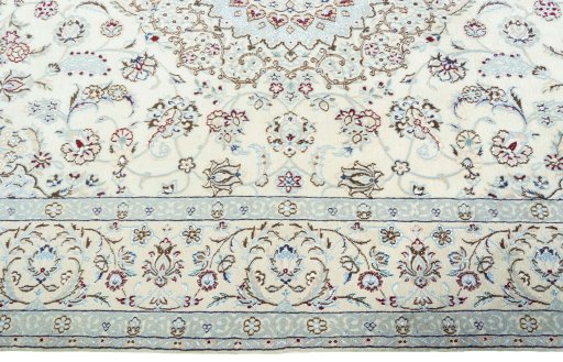 Corner detail of 2000s Nain rug showing border pattern and Wool pile