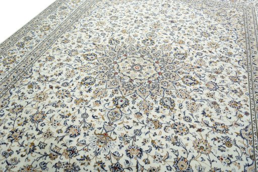 Backside of handmade 2000s Kashan rug showing knot structure and weave density