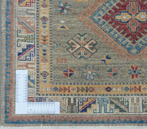Corner detail of New Kazak rug showing border pattern and Wool pile