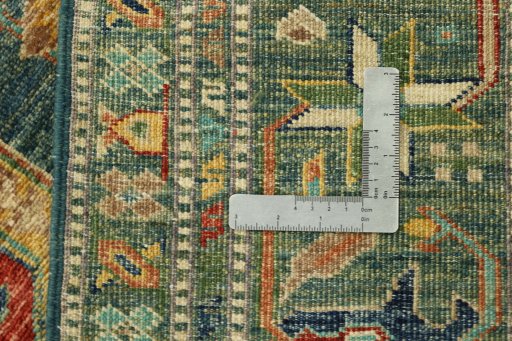 Backside of handmade New Kazak rug showing knot structure and weave density