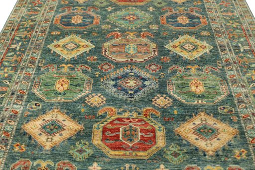 Backside of handmade New Kazak rug showing knot structure and weave density