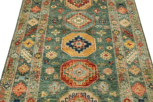 Backside of handmade New Kazak rug showing knot structure and weave density