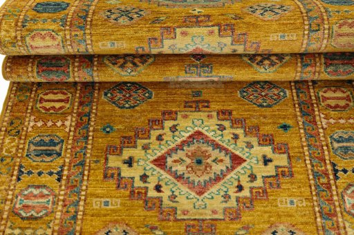 Corner detail of New Kazak rug showing border pattern and Wool pile