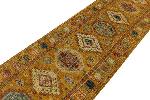Backside of handmade New Kazak rug showing knot structure and weave density