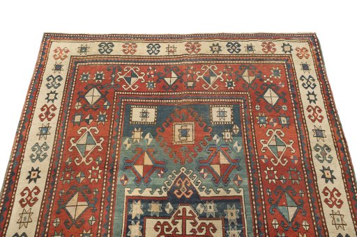 Surface texture of 1900s Kazak rug with natural Wool and intricate pattern