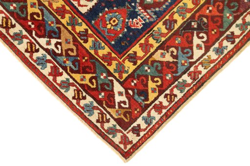 Backside of handmade 1900s Kazak rug showing knot structure and weave density