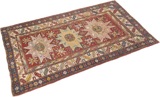 Corner detail of 1900s Kazak rug showing border pattern and Wool pile