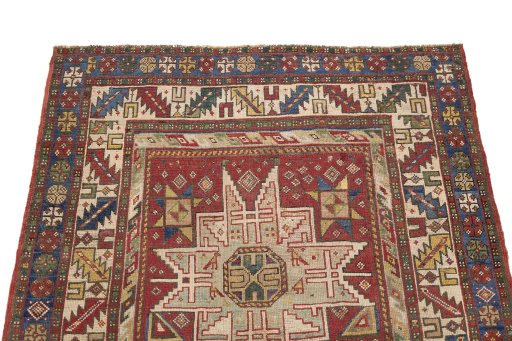 Surface texture of 1900s Kazak rug with natural Wool and intricate pattern