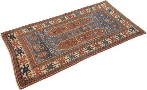 Corner detail of 1900s Kazak rug showing border pattern and Wool pile