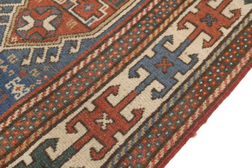 Central medallion detail of 1900s Kazak rug from Armenia