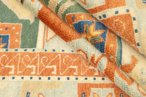 Corner detail of New Kazak rug showing border pattern and Wool pile