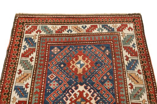 Surface texture of 1880s Kazak rug with natural Wool and intricate pattern