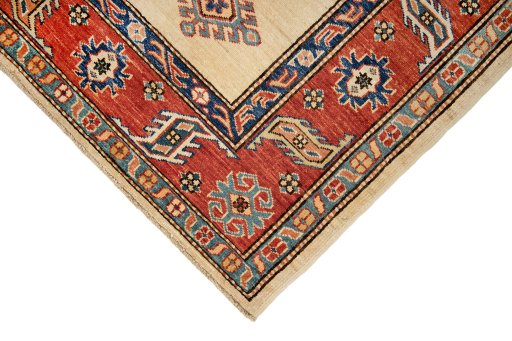Backside of handmade New Kazak rug showing knot structure and weave density