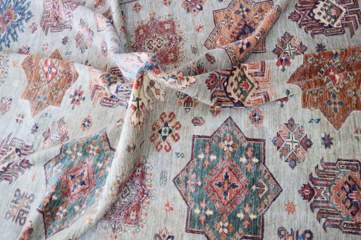 Backside of handmade New Kazak rug showing knot structure and weave density