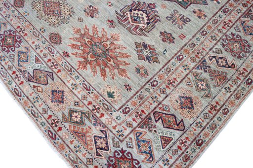 Full view of New Kazak rug from Pakistan, 367 × 274 cm in Multi Color tones