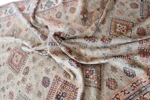 Backside of handmade New Kazak rug showing knot structure and weave density