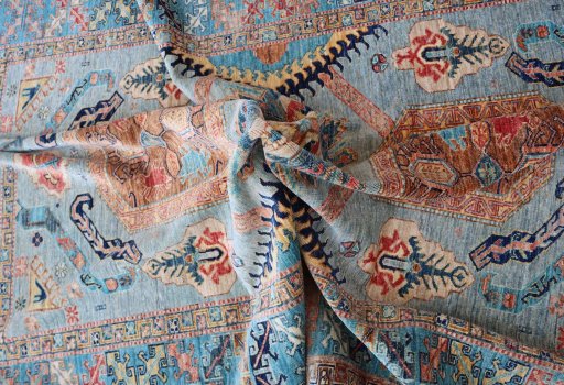 Backside of handmade New Kazak rug showing knot structure and weave density