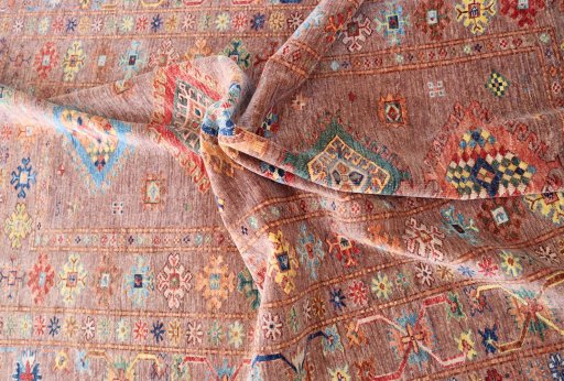 Backside of handmade New Kazak rug showing knot structure and weave density
