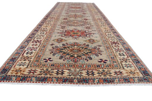 Corner detail of New Kazak rug showing border pattern and Wool pile