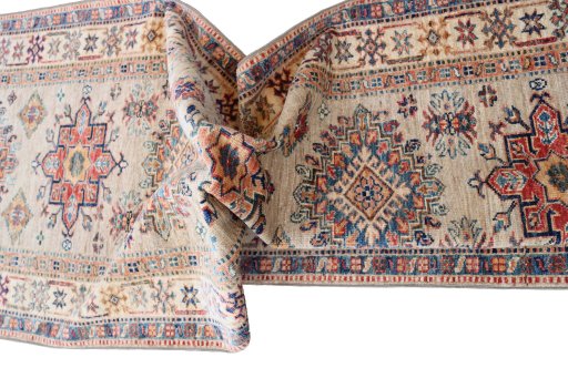 Backside of handmade New Kazak rug showing knot structure and weave density