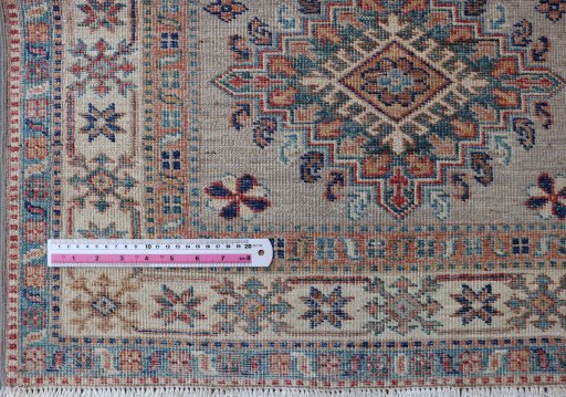 Central medallion detail of New Kazak rug from Pakistan