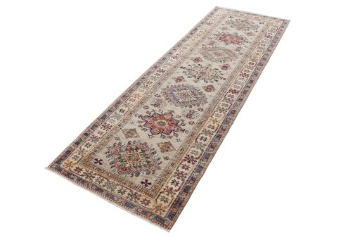 Corner detail of New Kazak rug showing border pattern and Wool pile