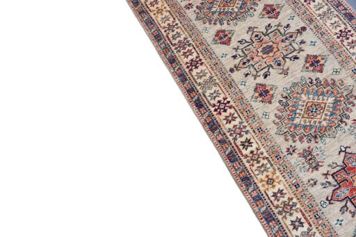 Backside of handmade New Kazak rug showing knot structure and weave density