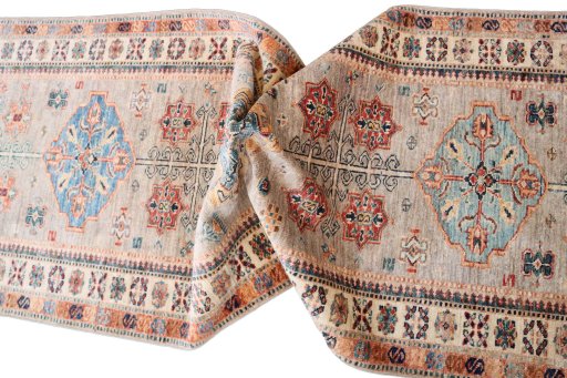 Backside of handmade New Kazak rug showing knot structure and weave density