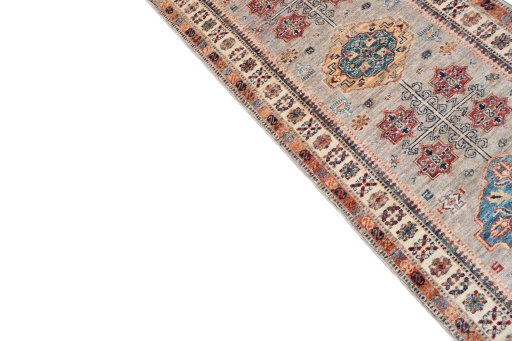 Backside of handmade New Kazak rug showing knot structure and weave density