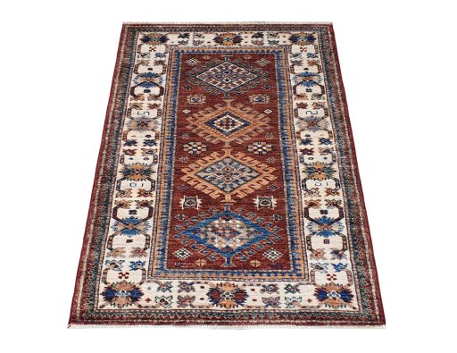 Corner detail of New Kazak rug showing border pattern and Wool pile