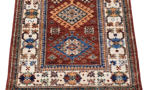 Surface texture of New Kazak rug with natural Wool and intricate pattern