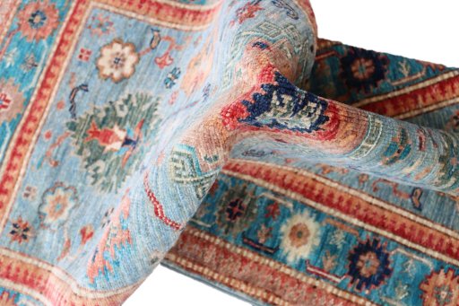 Backside of handmade New Kazak rug showing knot structure and weave density