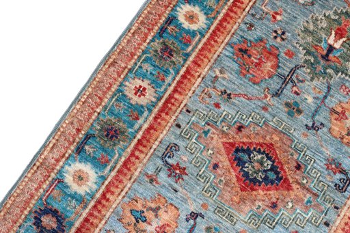 Backside of handmade New Kazak rug showing knot structure and weave density