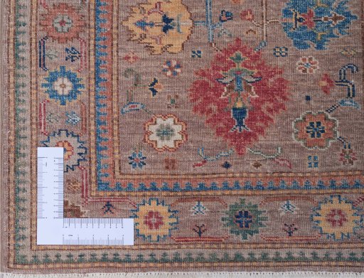 Corner detail of New Kazak rug showing border pattern and Wool pile