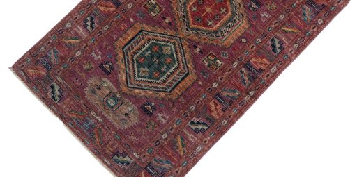 Backside of handmade New Kazak rug showing knot structure and weave density