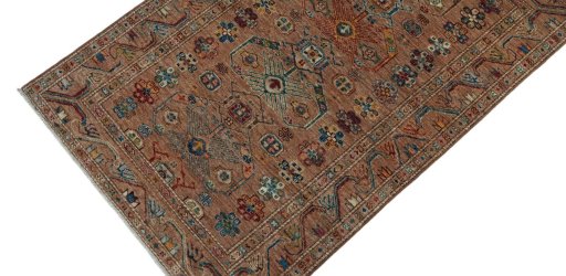 Backside of handmade New Kazak rug showing knot structure and weave density