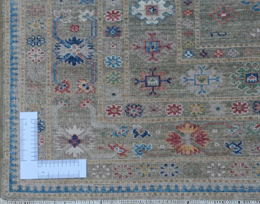 Corner detail of New Kazak rug showing border pattern and Wool pile