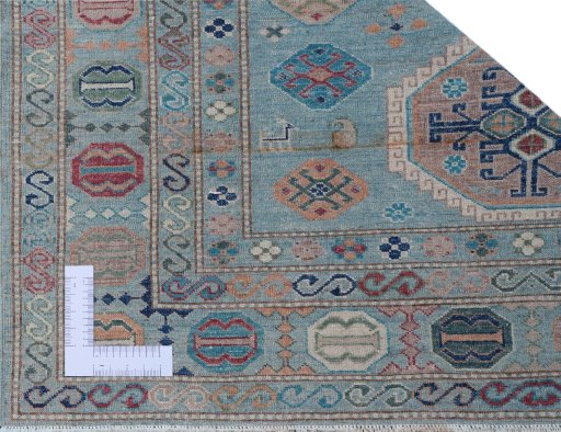 Corner detail of New Kazak rug showing border pattern and Wool pile