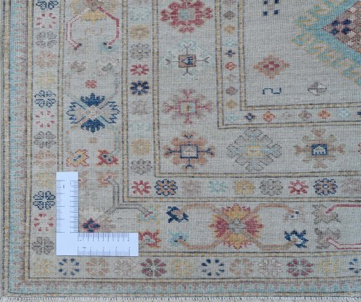 Corner detail of New Kazak rug showing border pattern and Wool pile