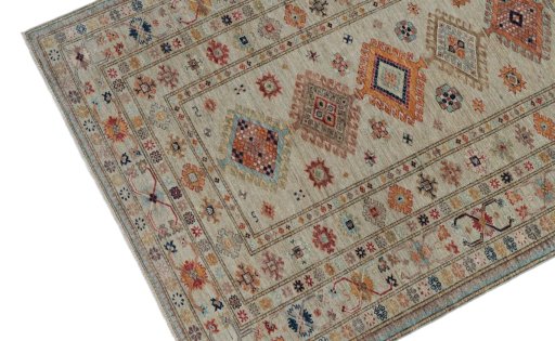 Backside of handmade New Kazak rug showing knot structure and weave density