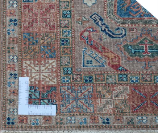 Corner detail of New Kazak rug showing border pattern and Wool pile