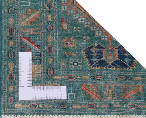 Corner detail of New Kazak rug showing border pattern and Wool pile