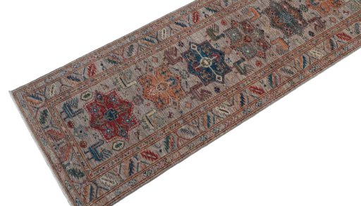 Backside of handmade New Kazak rug showing knot structure and weave density