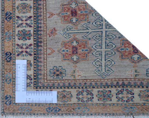Corner detail of New Kazak rug showing border pattern and Wool pile