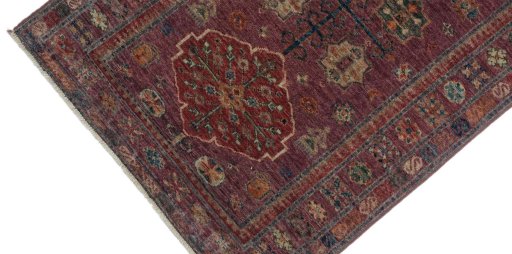 Backside of handmade New Kazak rug showing knot structure and weave density
