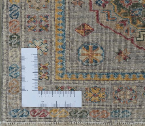 Corner detail of New Kazak rug showing border pattern and Wool pile
