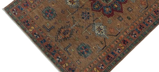 Backside of handmade New Kazak rug showing knot structure and weave density