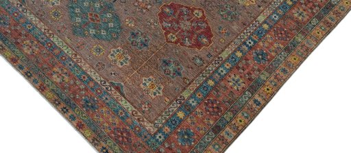 Backside of handmade New Kazak rug showing knot structure and weave density