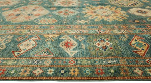 Corner detail of New Kazak rug showing border pattern and Wool pile