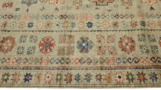 Corner detail of New Kazak rug showing border pattern and Wool pile